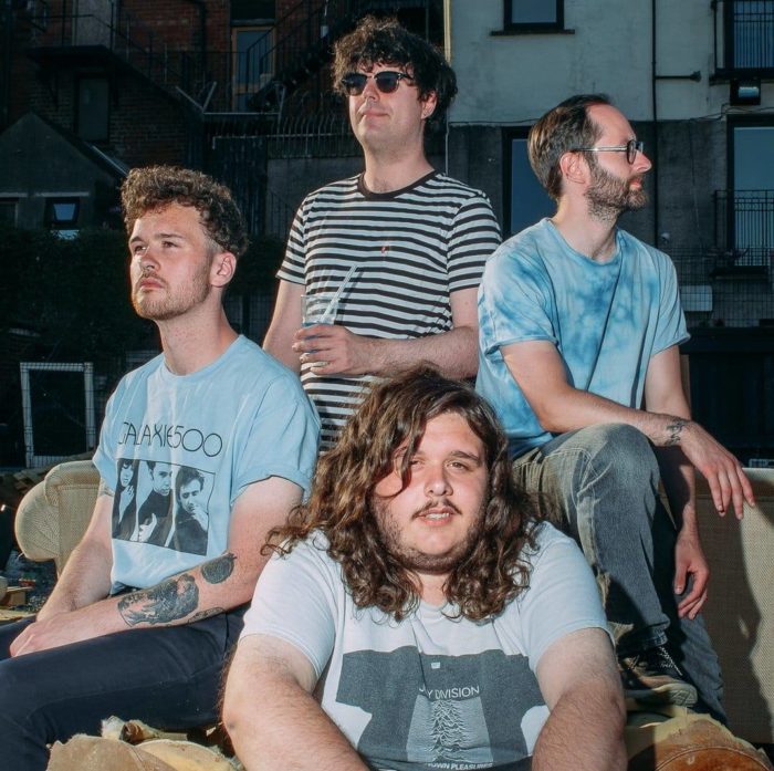 Junk Drawer Promo Picture of the band gazing into the ether